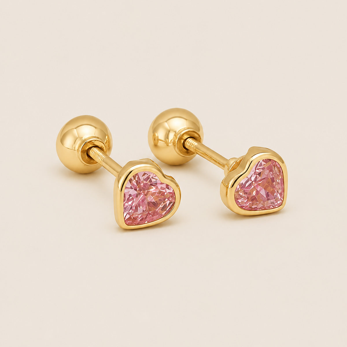 ARETES ABRIDORES CORAZÓN ROSADO REVERSIBLE 18K