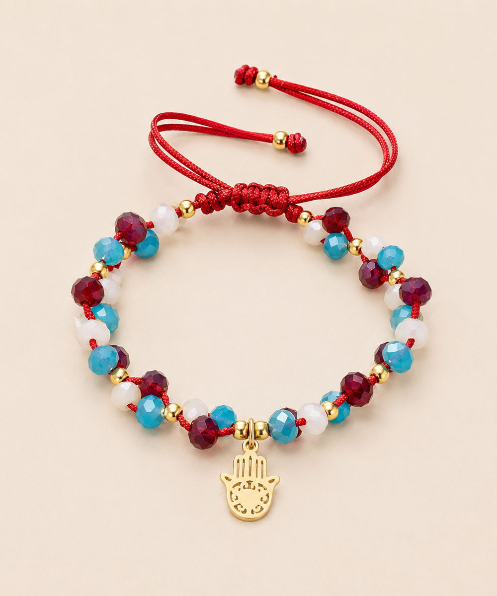 PULSERA MANO HAMSA GUINDA